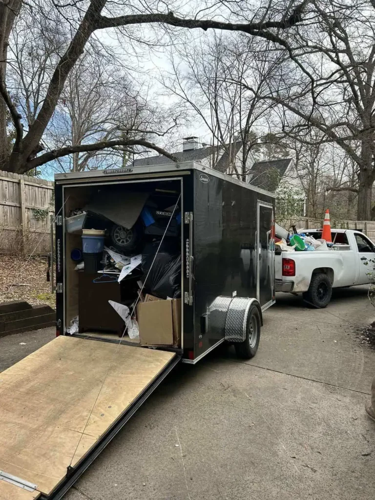 A trailer packed with garbage, highlighting a junk removal service in Raleigh, NC, dedicated to cleaning up the mess.